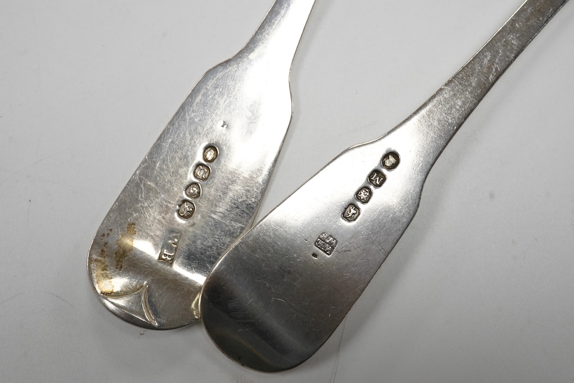 A matched part canteen of 19th century silver fiddle pattern flatware, various dates and makers, including a set of four George III table forks, Eley & Fearn, London, 1807, 28oz, and one plated table spoon.